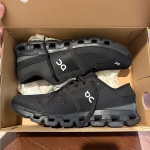 On Running Black Athletic Shoes with CloudTec Sole